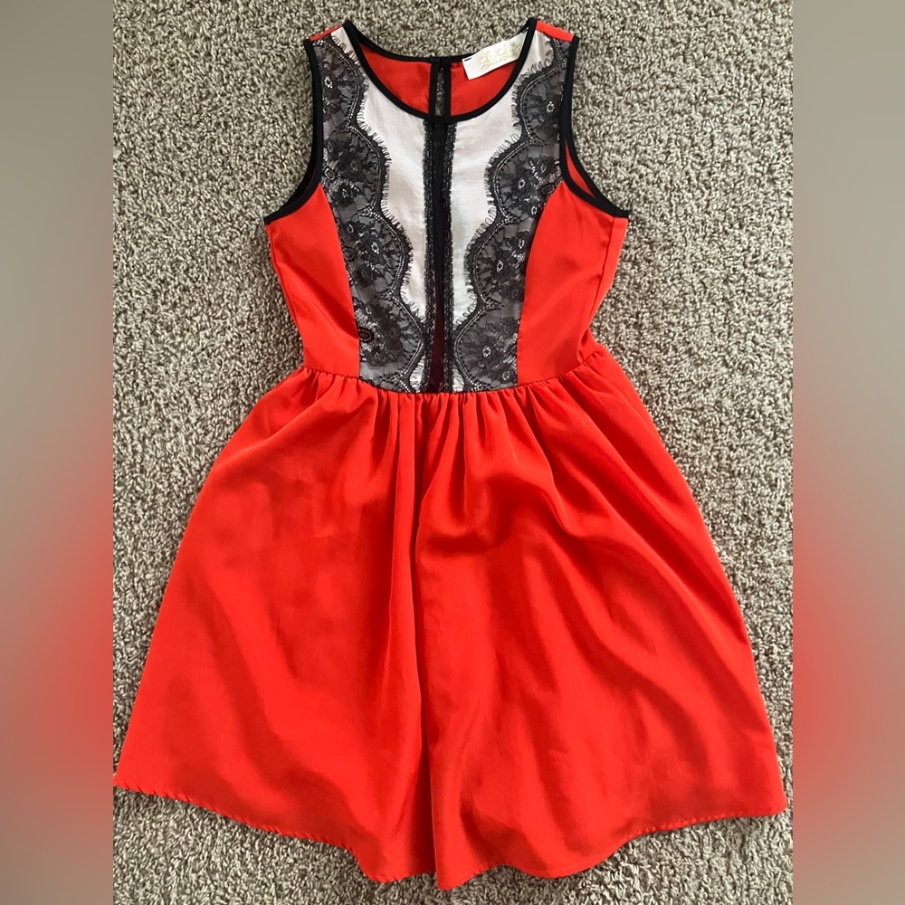 LuLu’s size small adorable dress. Color is red/orange with black lace.